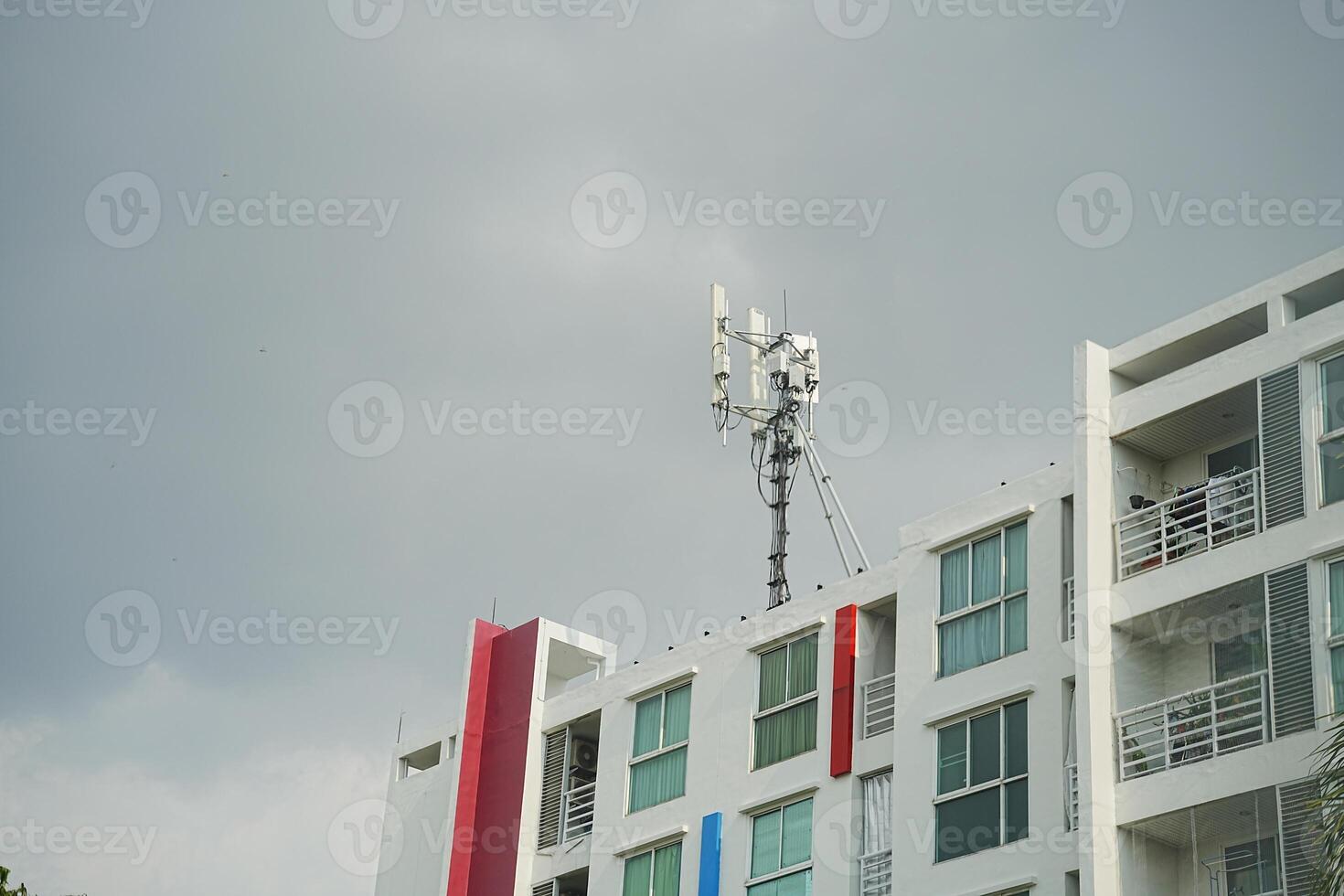 A building with a cell phone tower on top of it photo