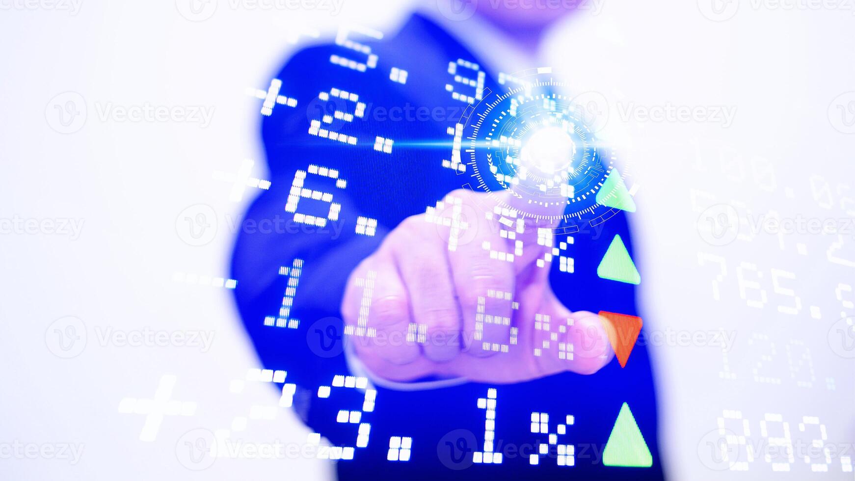 A man in a suit pressing a button on a screen photo