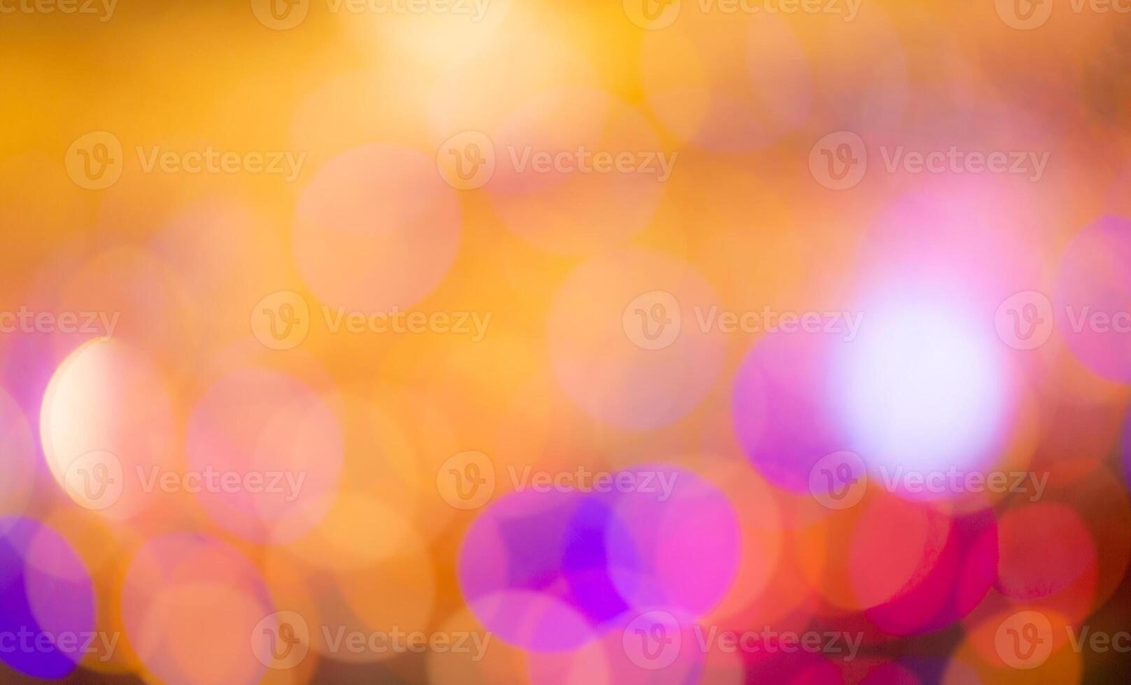 A blurry image of a colorful light bulb photo