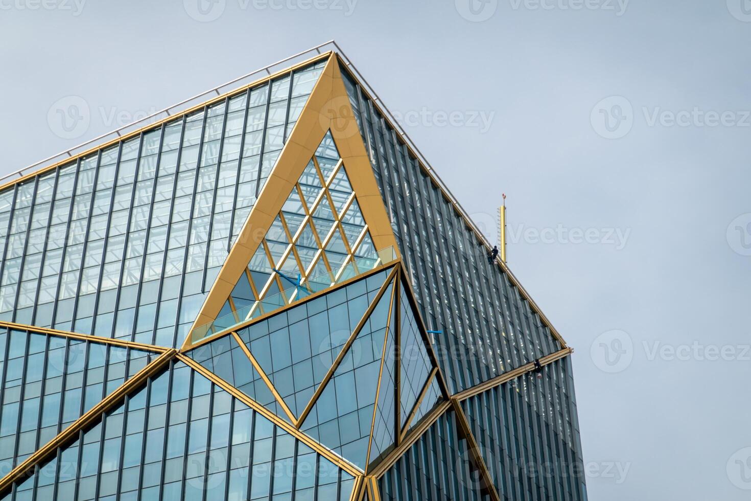 A building with a large gold triangle on top photo