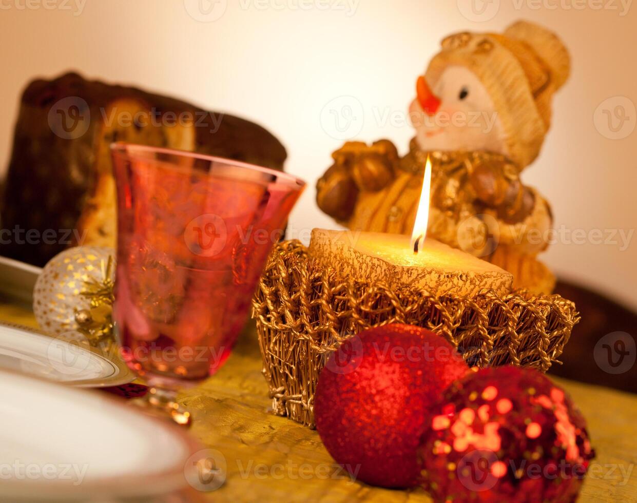 Table with candle for Christmas dinner photo