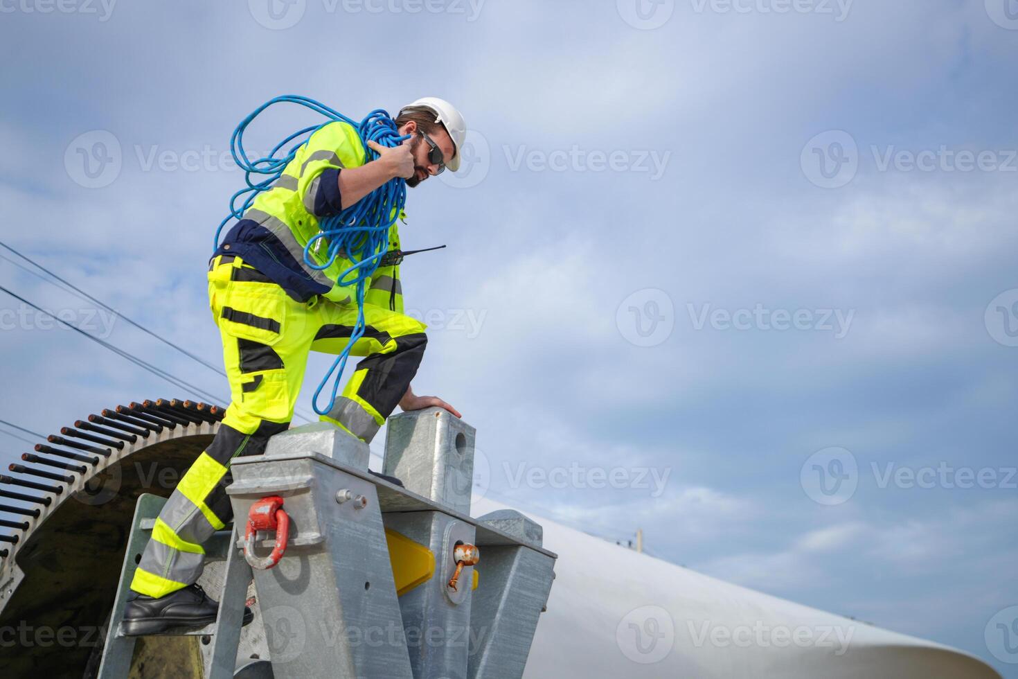 A man wearing a yellow jacket photo