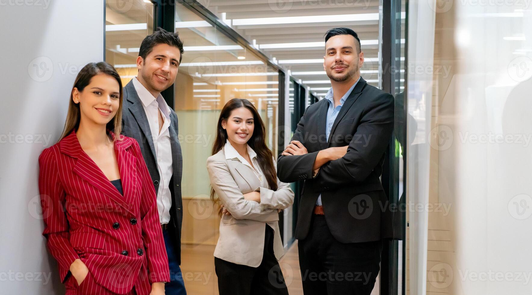 Business people standing in an office hallway photo