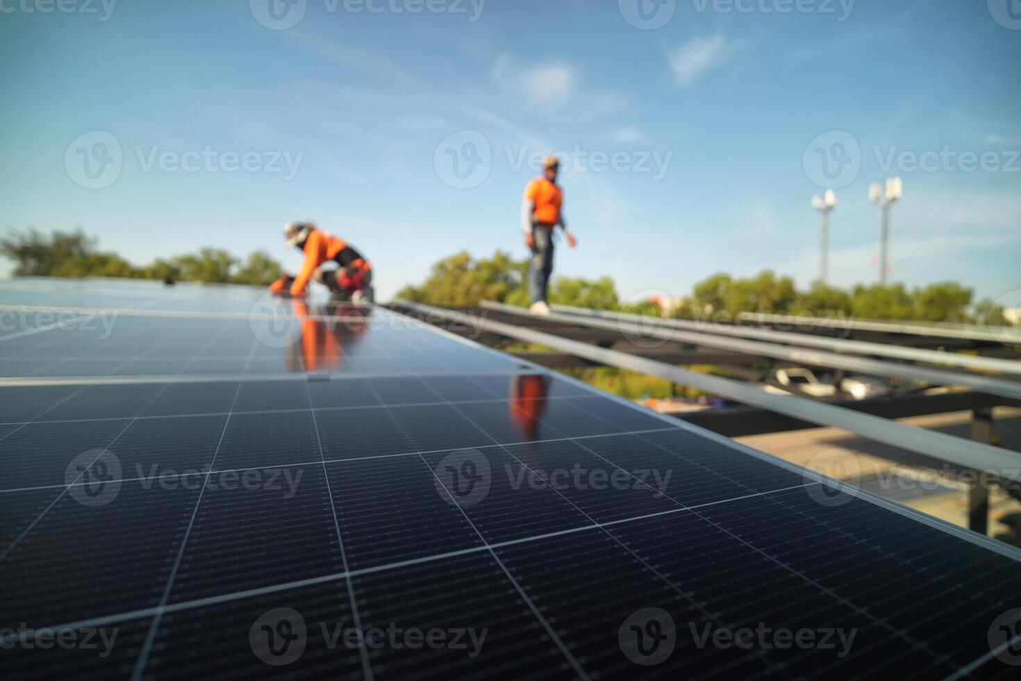 Two men are working on a solar panel photo