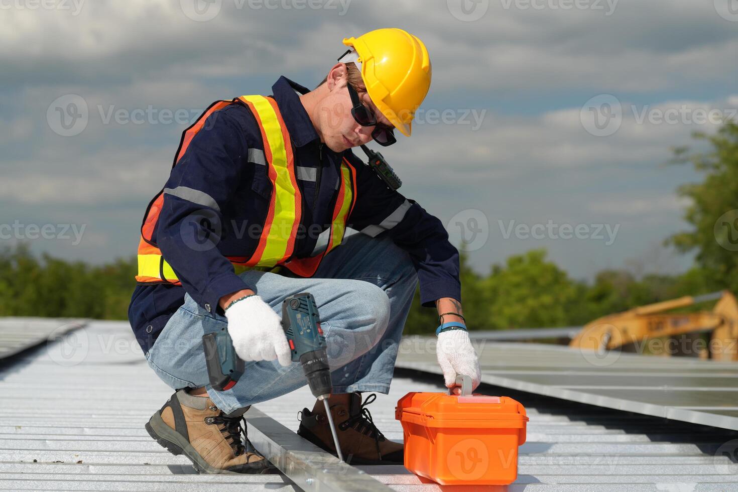 A man working on a roof photo