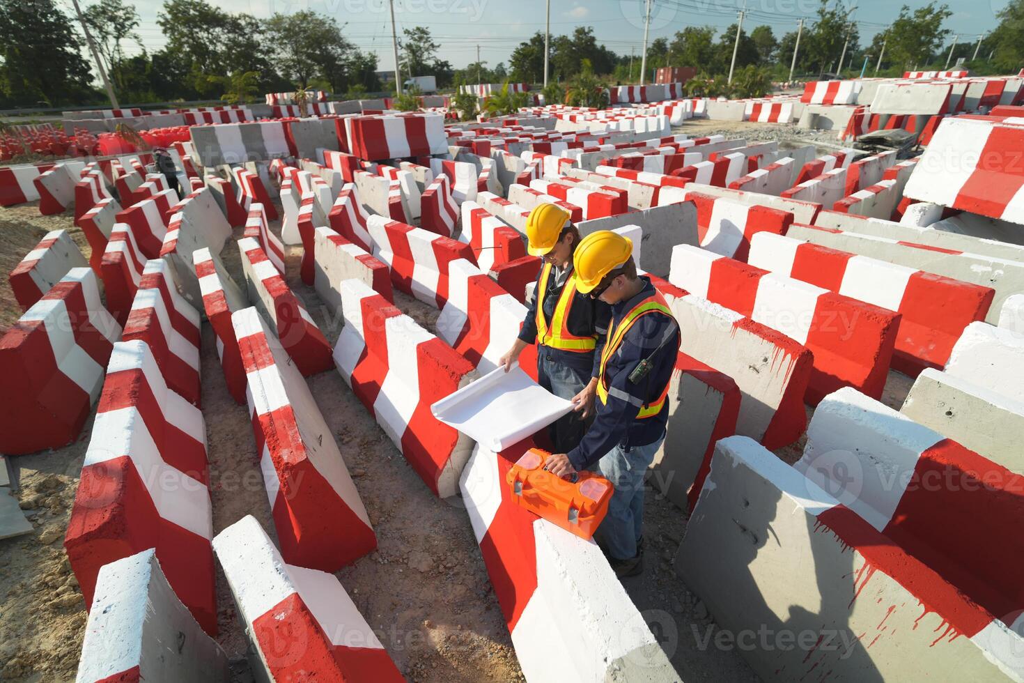 Two surveyor of construction engineer, architect, in hardhat working on construction site. photo