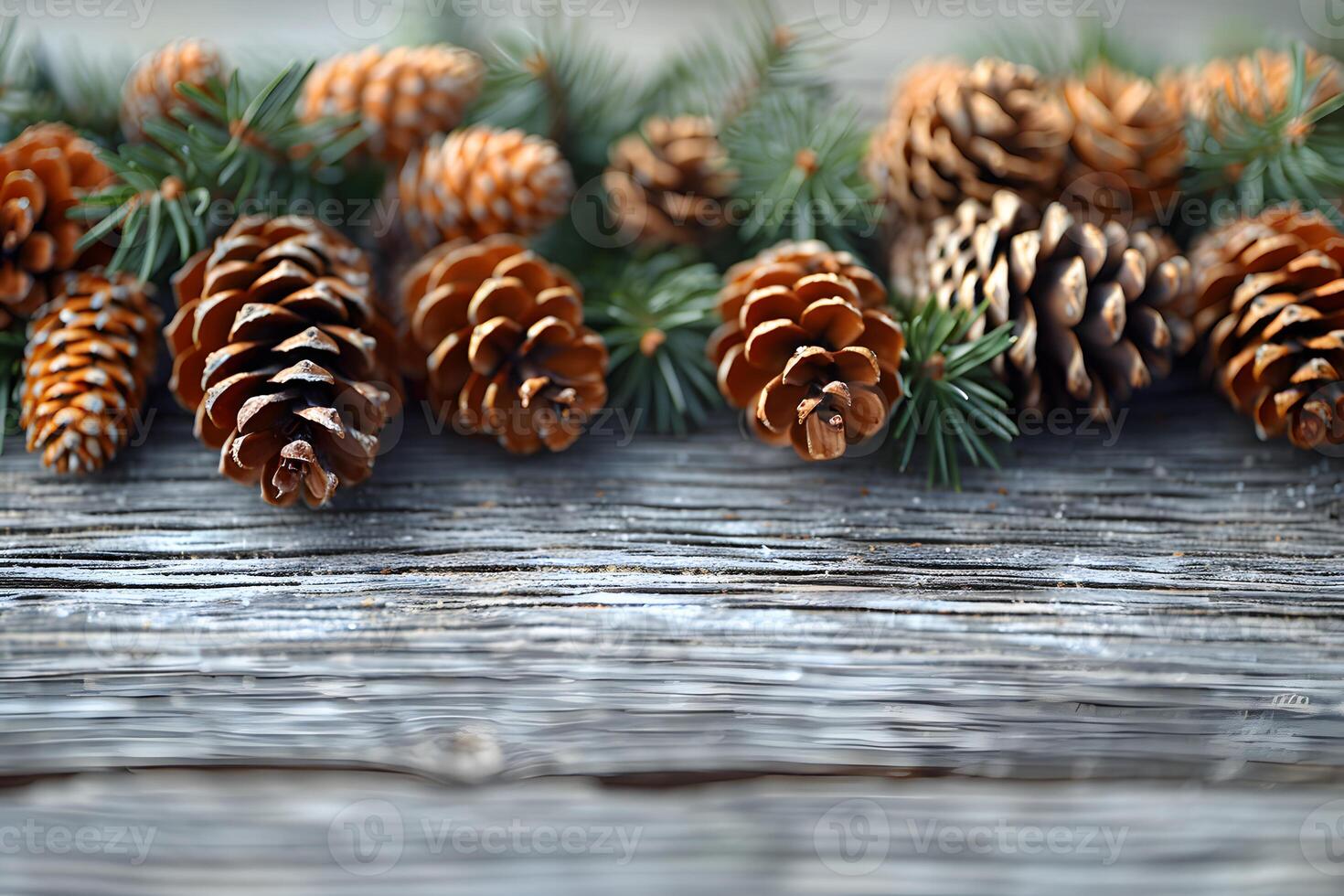 Rustic Pine Cones and Evergreen Branches on Weathered Wooden Surface for Seasonal Decor photo