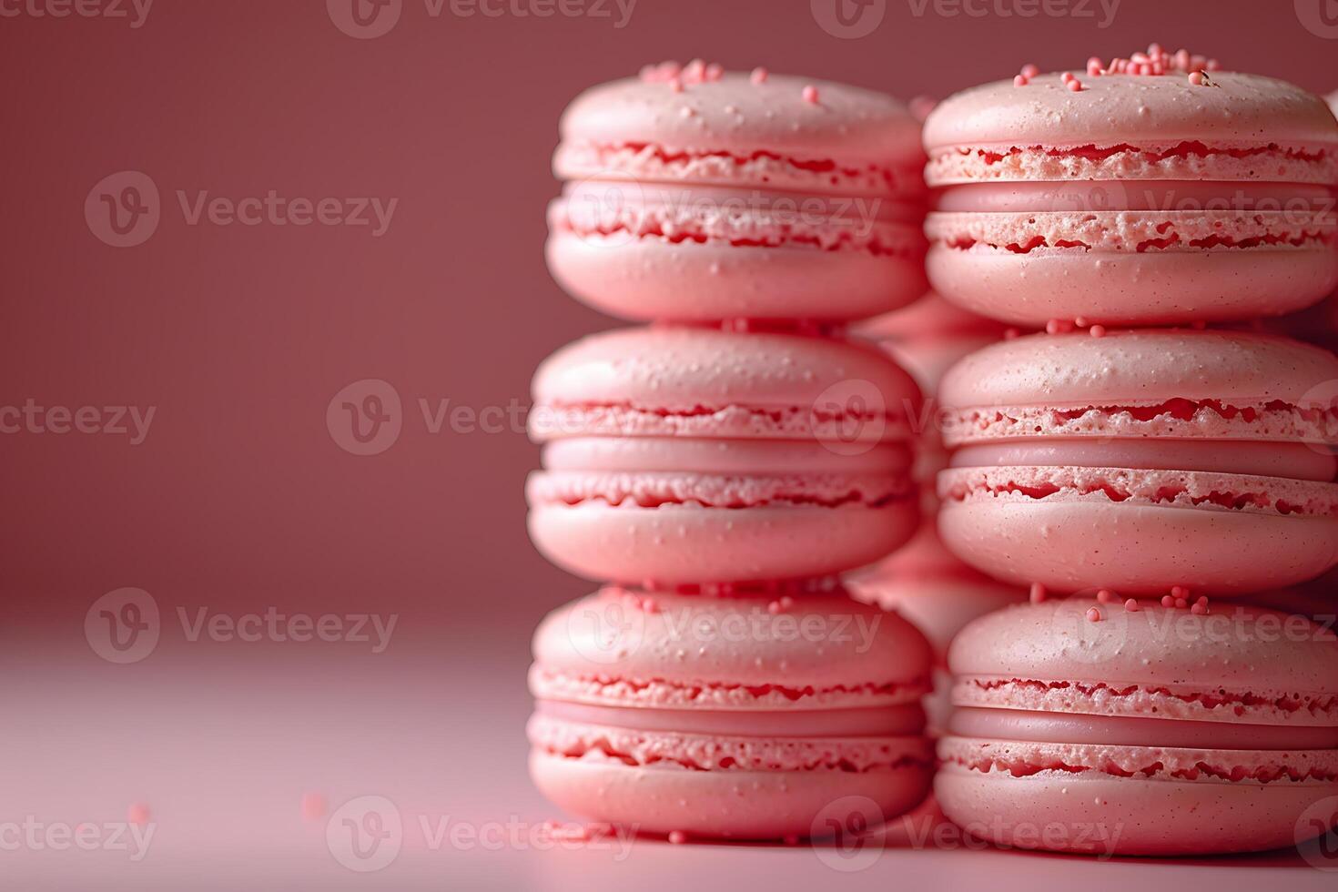 Pink Macarons Stacked Against a Soft Pink Background for Culinary and Dessert Themes photo