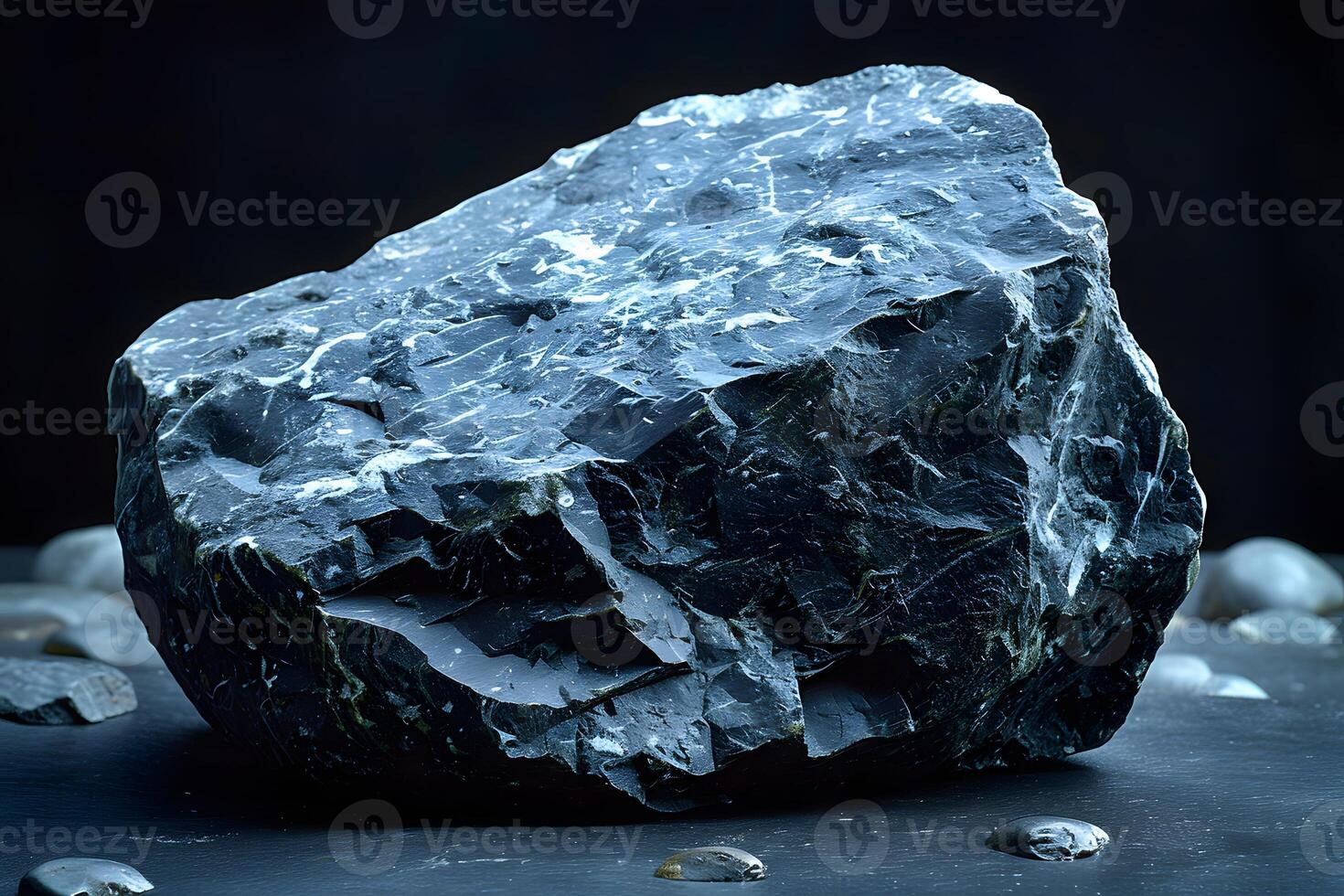Raw Obsidian Rock on Dark Background for Geology and Design Purposes photo