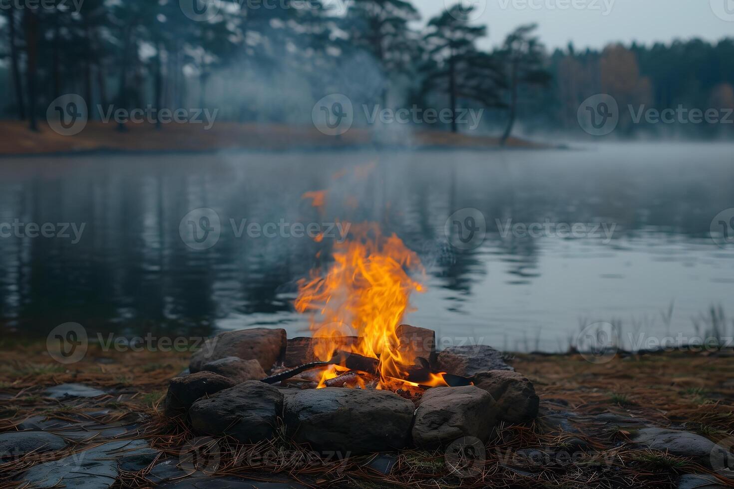 Serene Lakeside Campfire in Misty Forest for Tranquil Outdoor Experiences photo