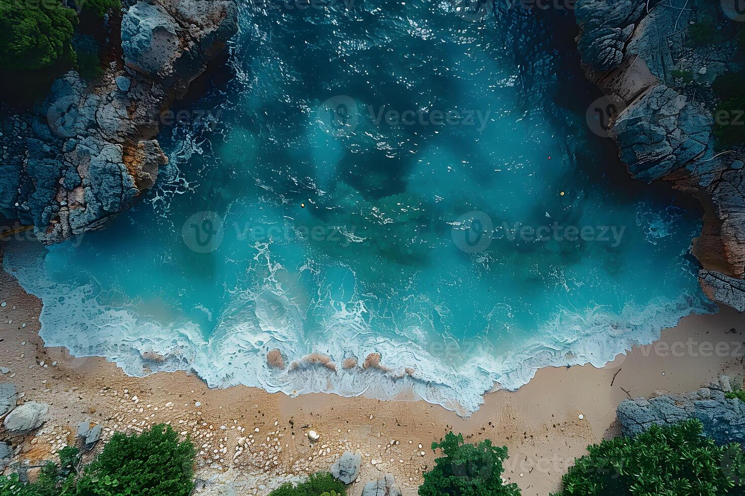 Serene Aerial View of Turquoise Waves Crashing on Rocky Seashore for Coastal Wall Art or Travel Brochure photo