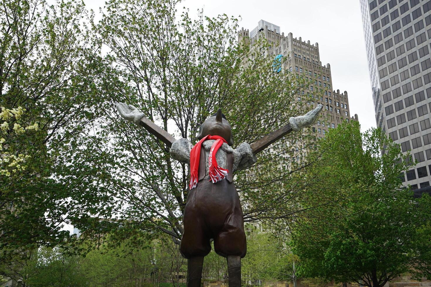 Exterior architecture and design at 'SAINT LOUIS CITY GARDEN' with bronze Pinocchio sculpture stands atop wheeled cart Sculpted in 2009 by Jim Dine- Missouri, United States photo