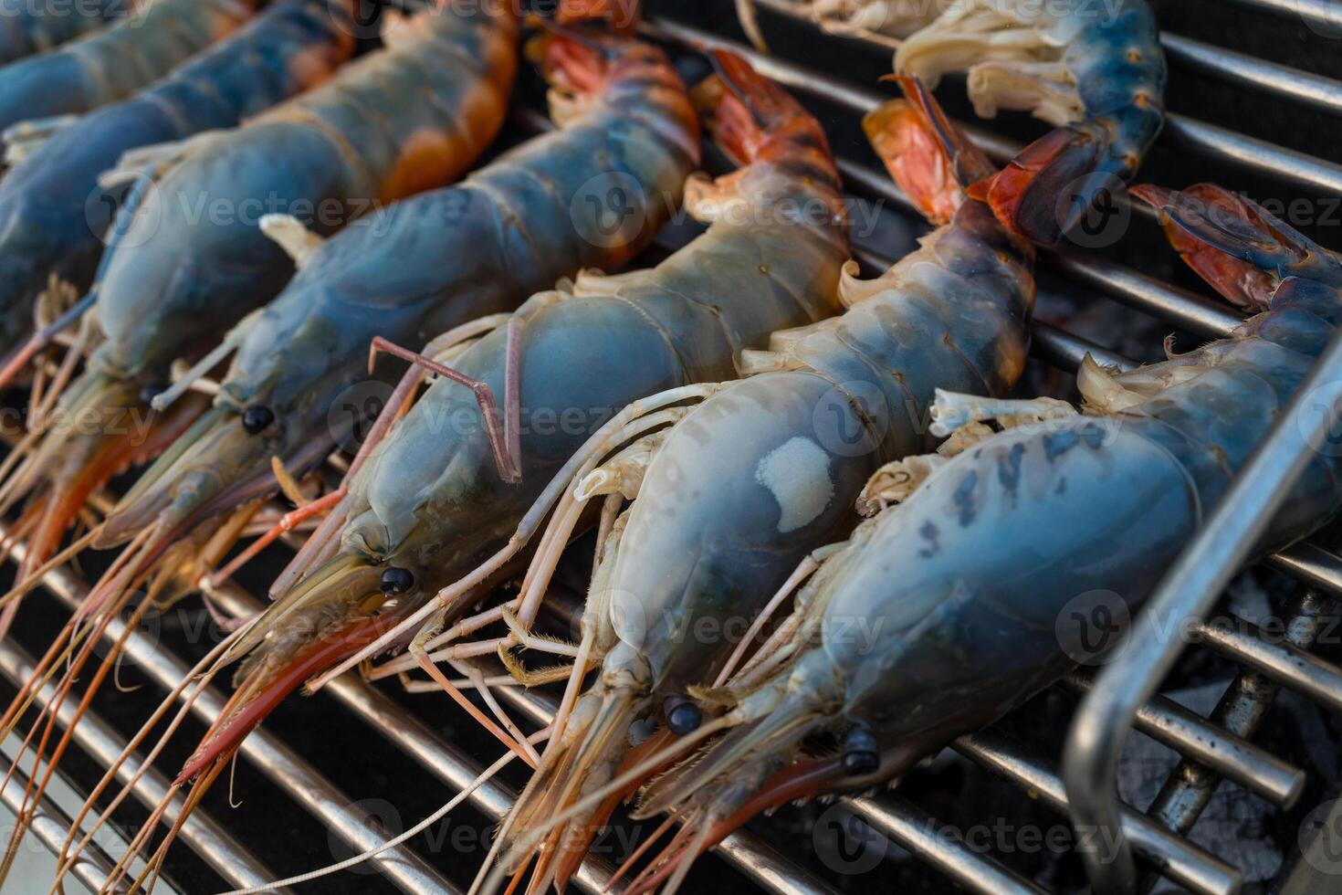 Fresh river prawn grilled on charcoal stove photo
