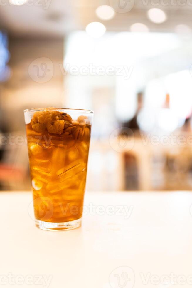 Cold drink of longan juice with ice decoration with longan fruit seedless. photo