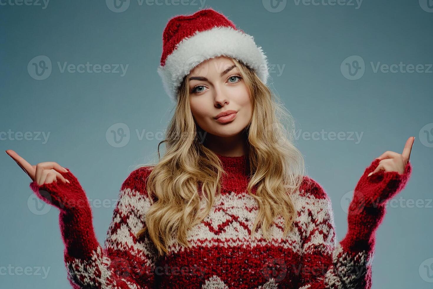A beautiful young woman in a christmas sweater and hat photo