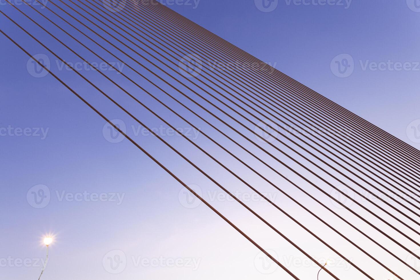 A bridge with a blue sky and a light photo
