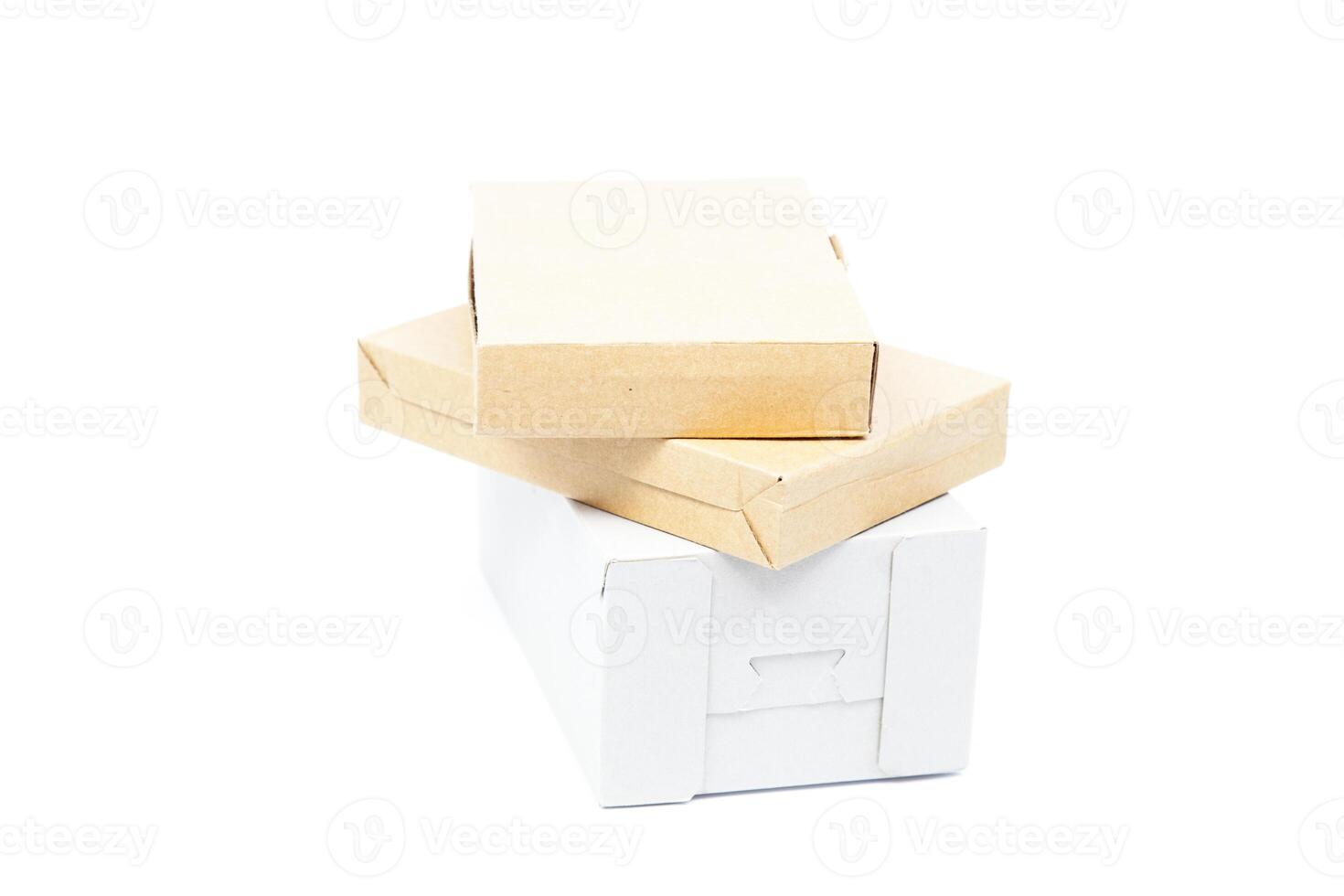 A stack of boxes and a white box photo