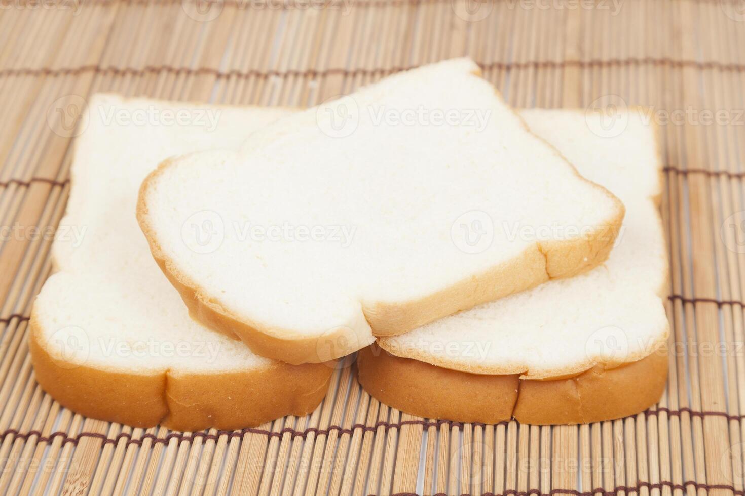 Sliced bread on a bamboo mat photo