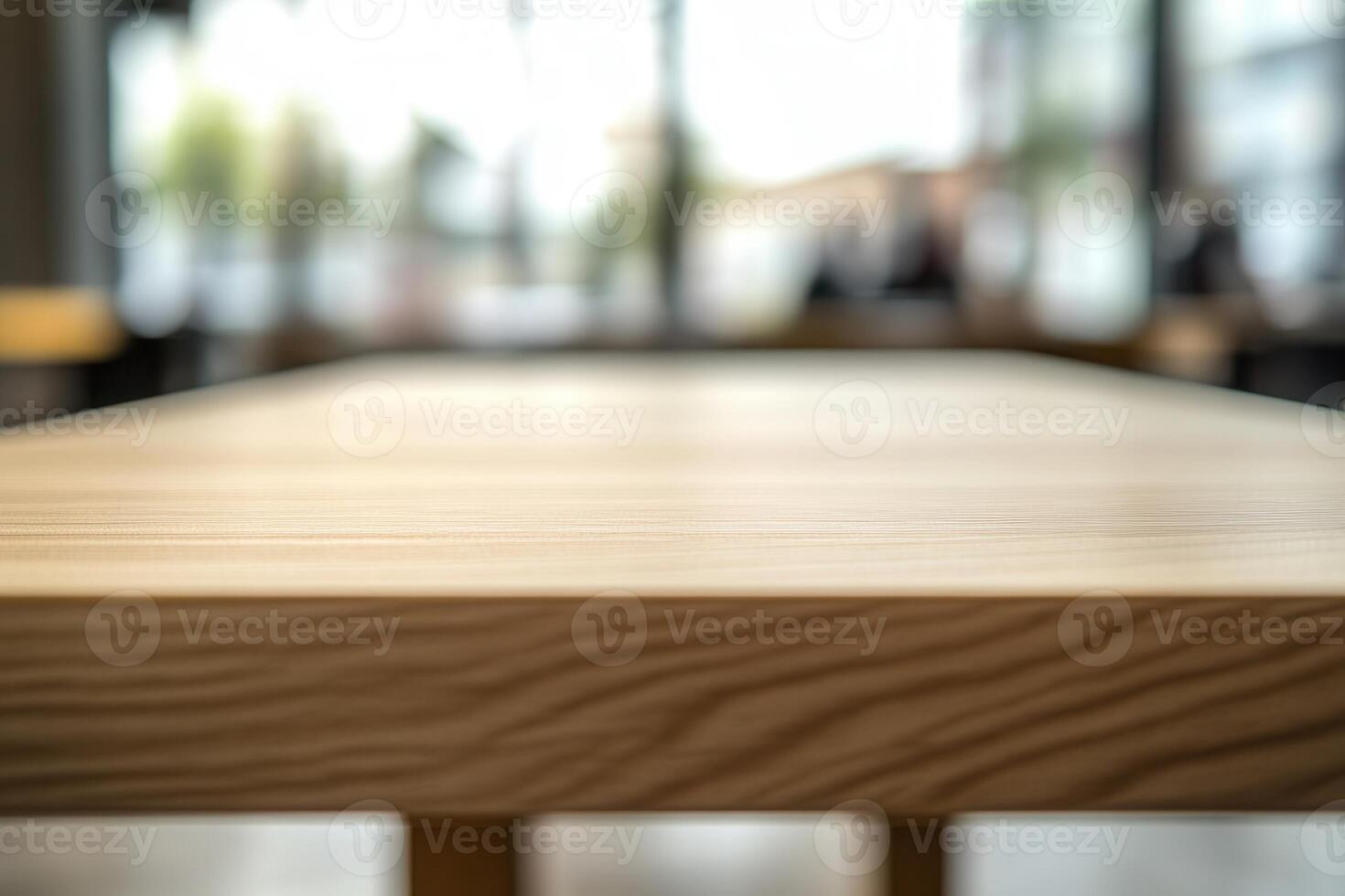 Blurred view of a wooden table in a modern setting. photo