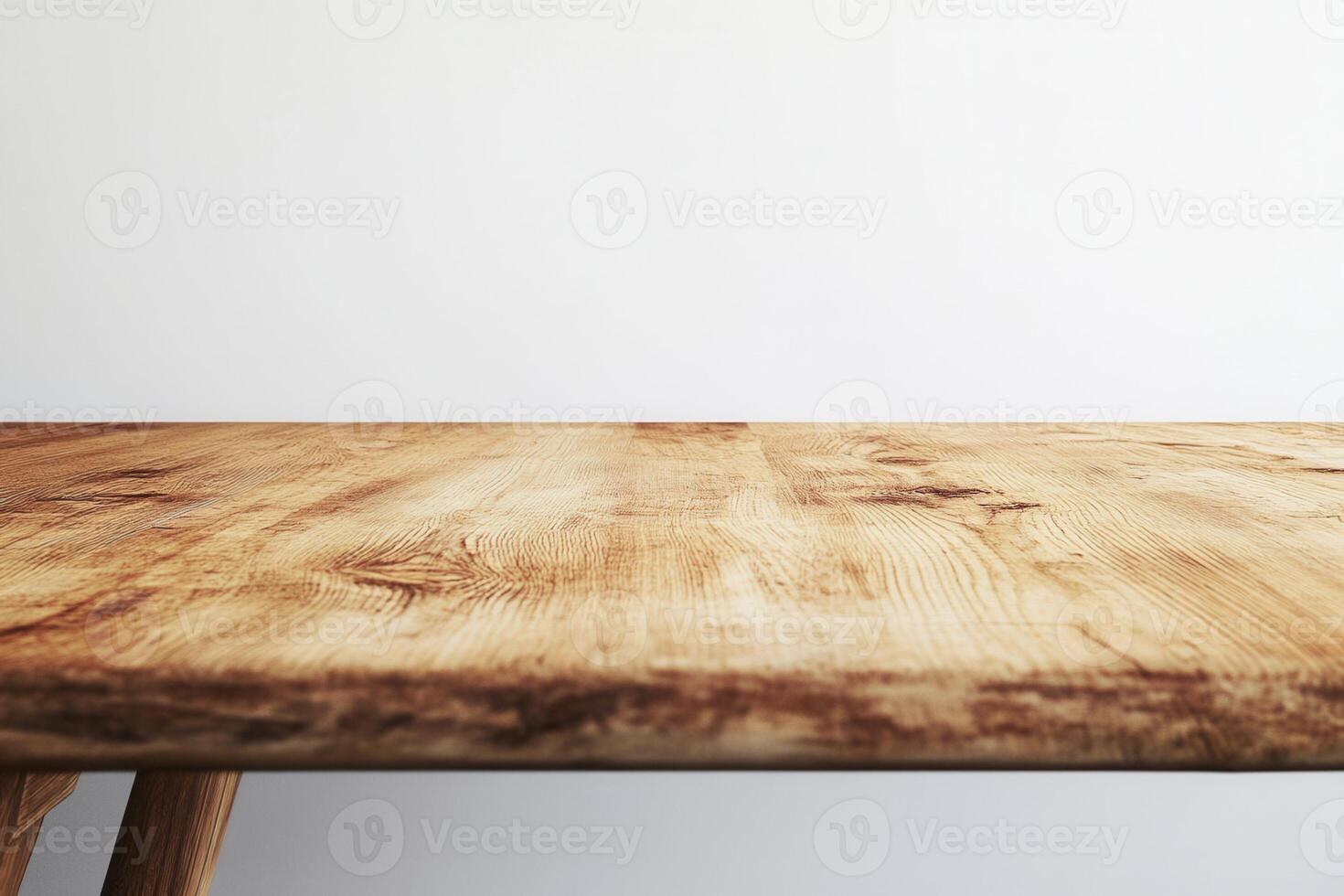A close-up view of a wooden table surface. photo