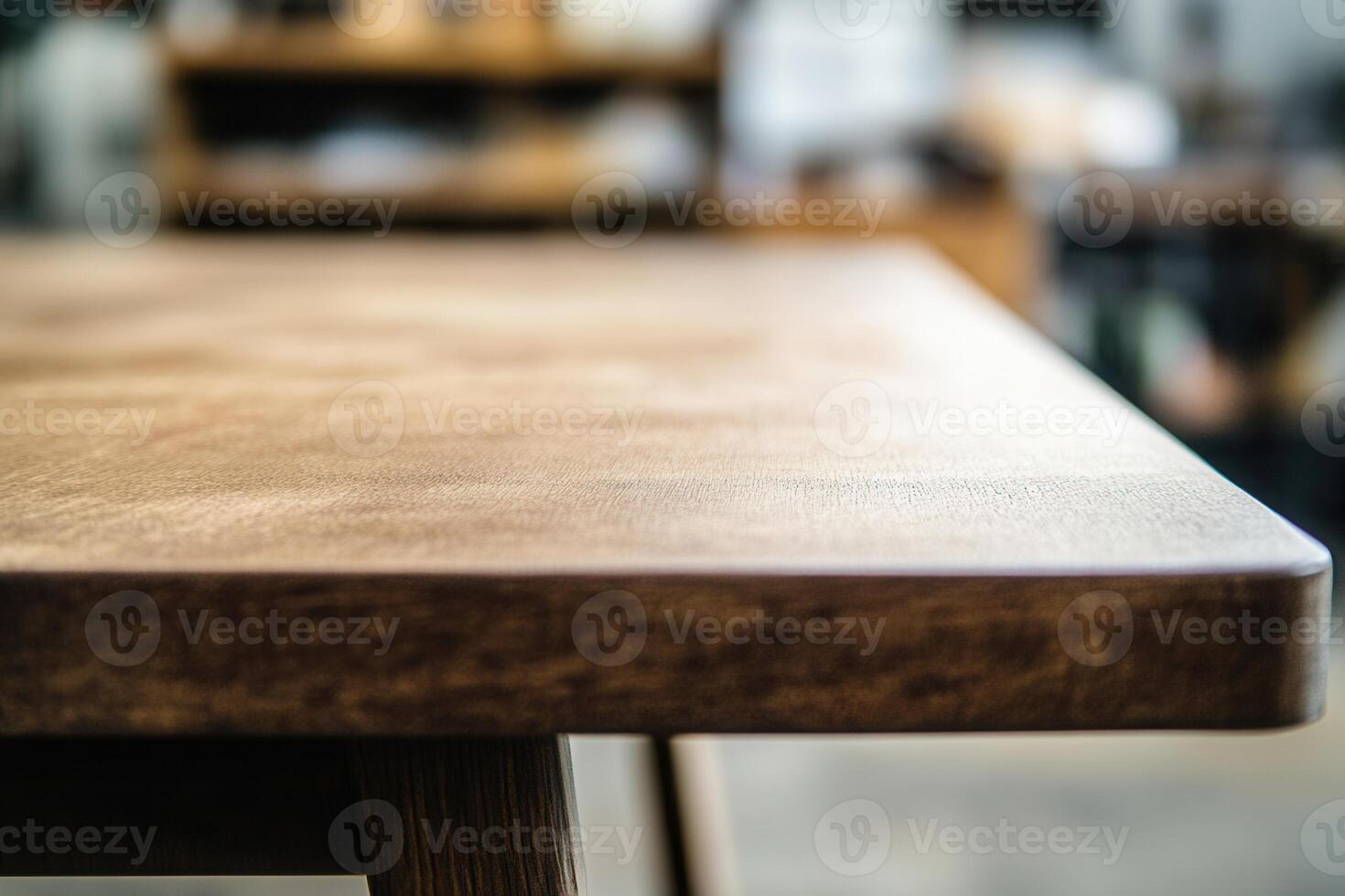 Close-up of a wooden table edge in a workspace. photo