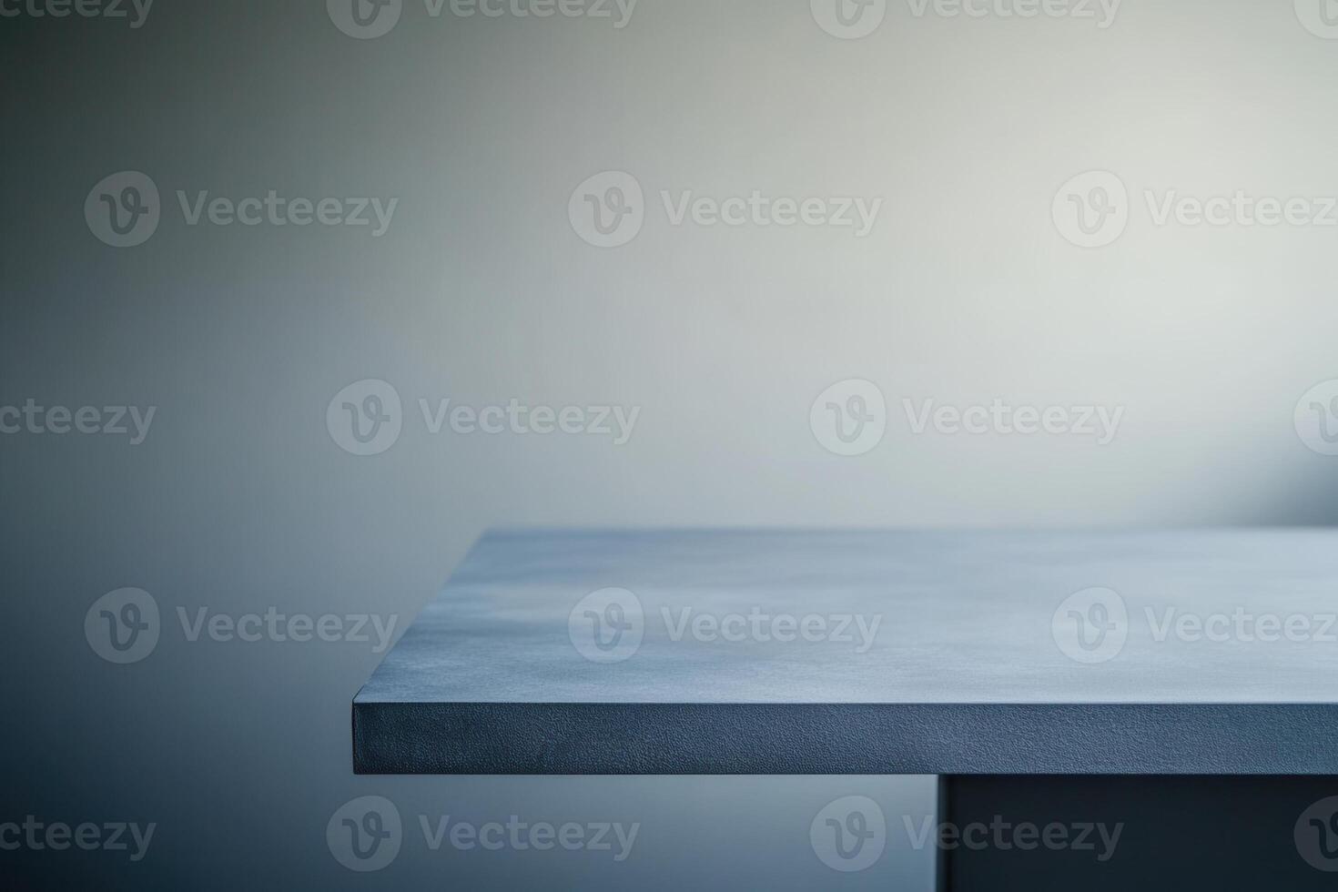 Minimalist gray table against a soft gradient background. photo