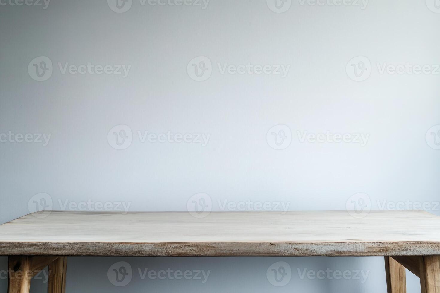 Minimalist wooden table against a plain background. photo