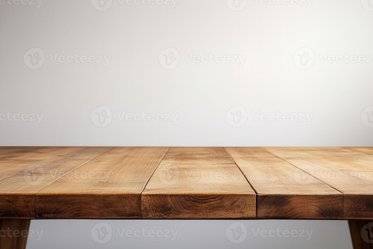 Wooden table with a plain background for versatile use. photo