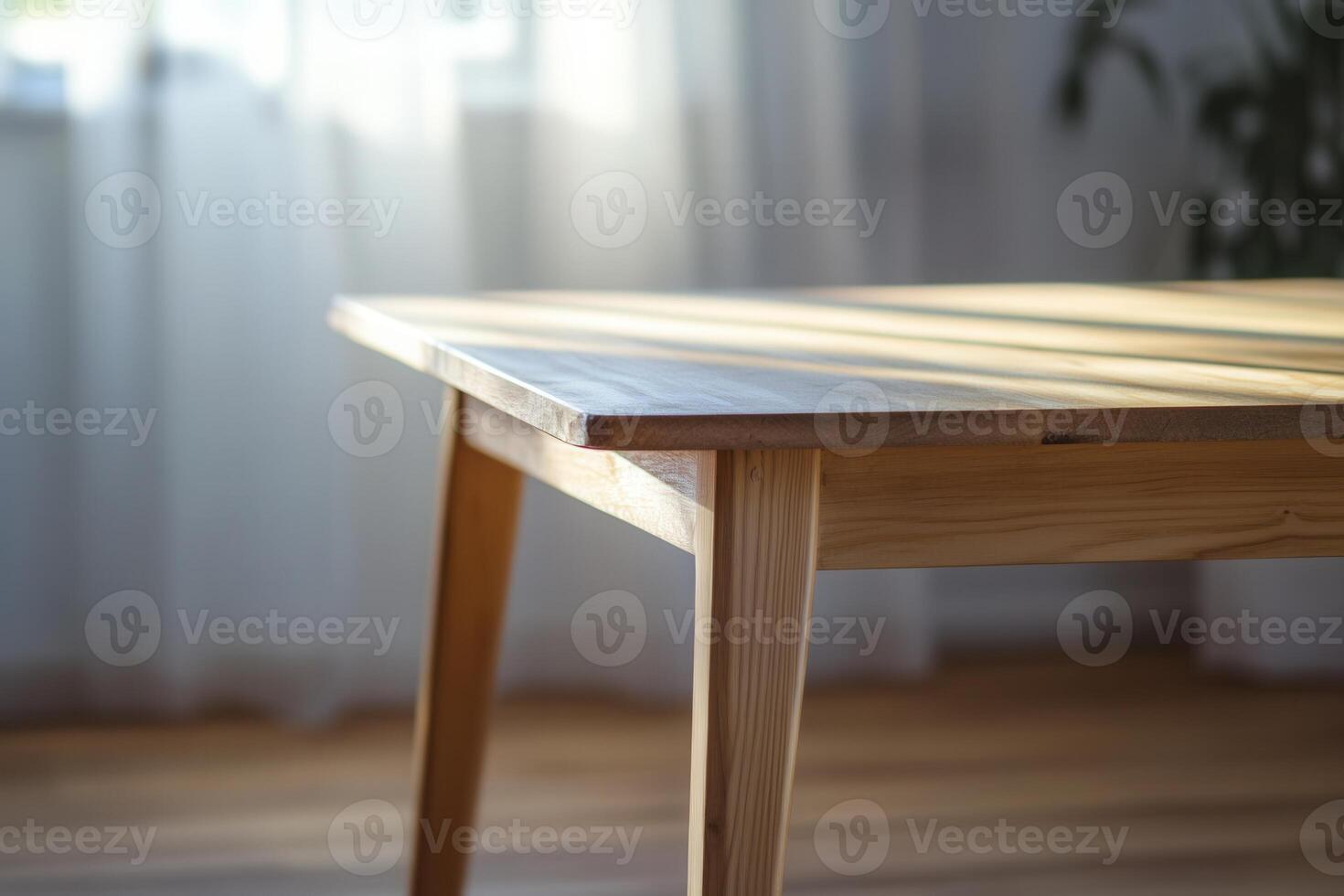 Wooden table with soft lighting in a cozy interior. photo