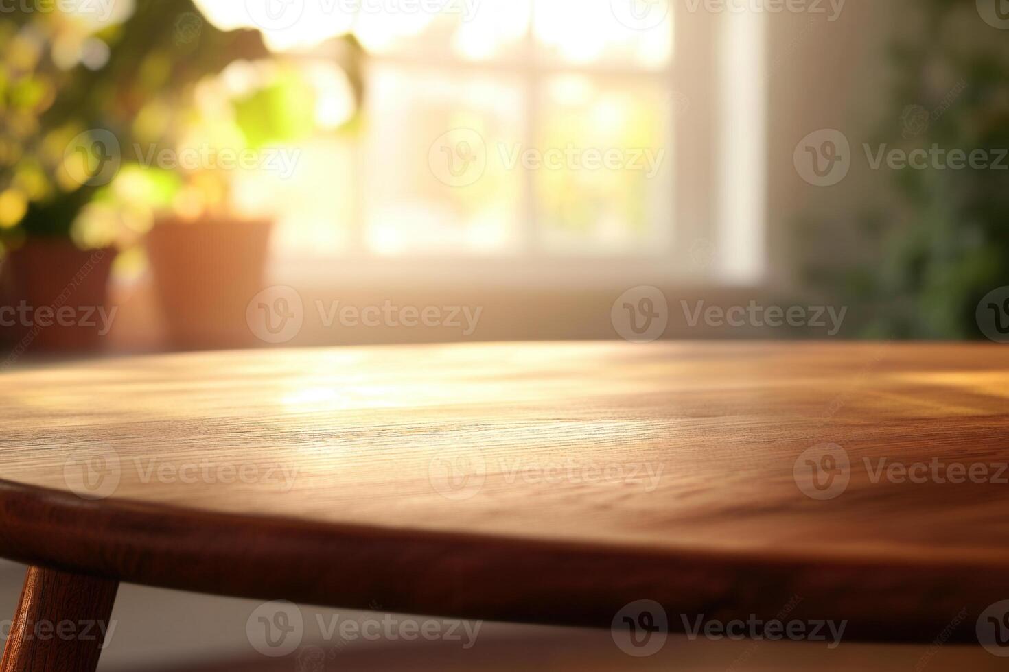 Wooden table with soft lighting and plants in the background. photo