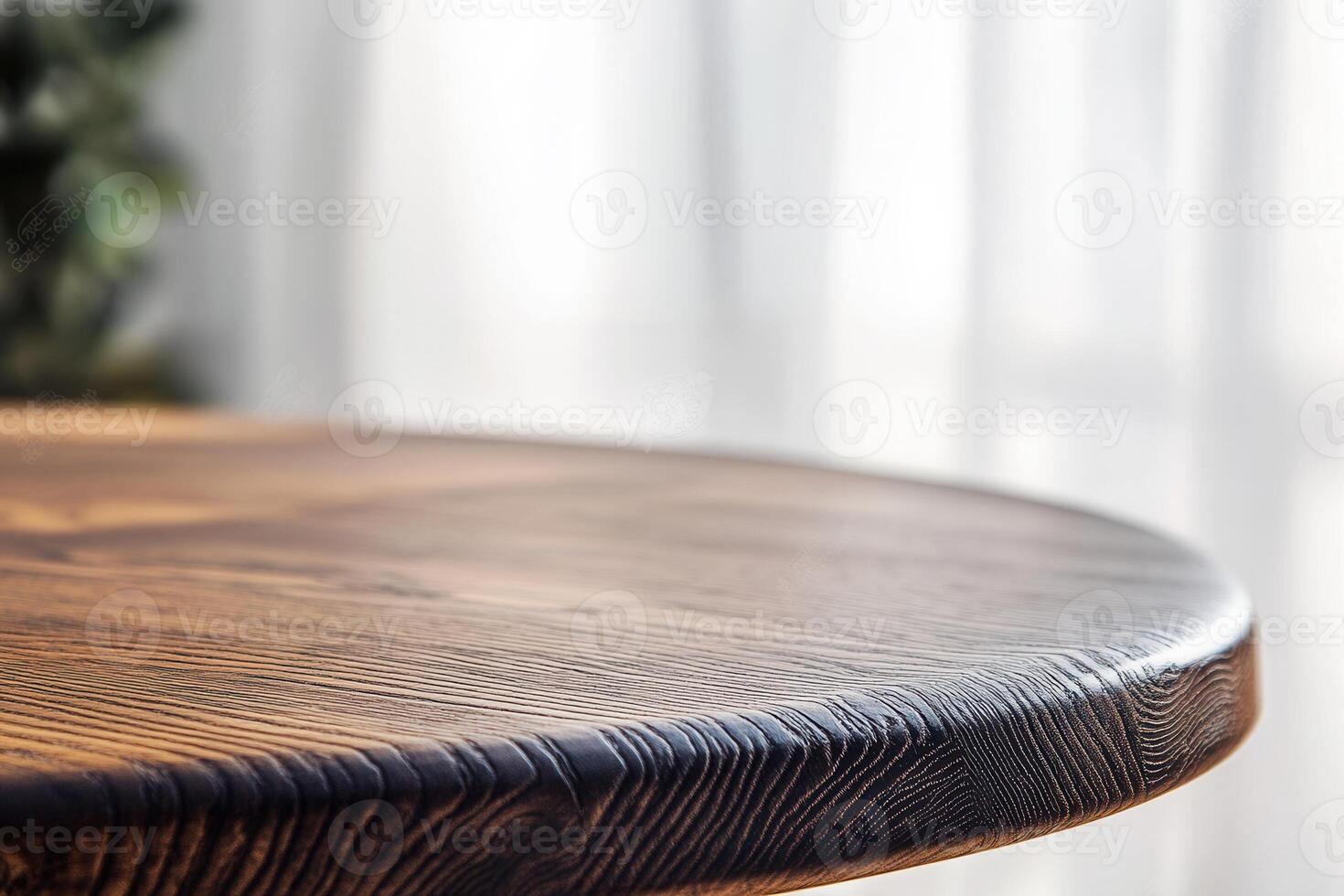 Close-up of a wooden table surface with soft lighting. photo