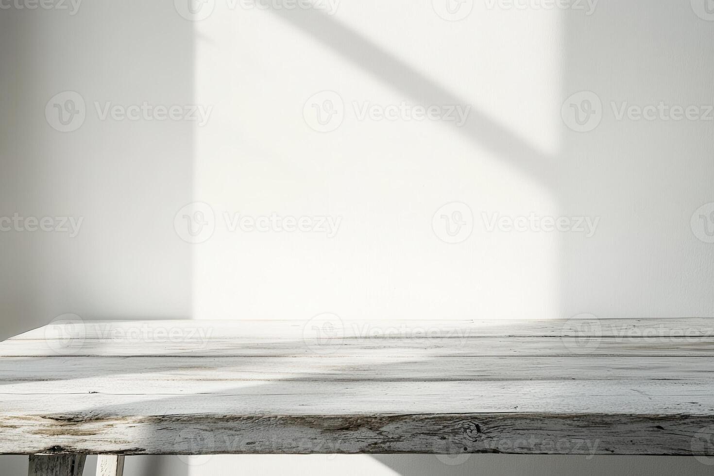 Minimalist wooden table with natural light shadows. photo
