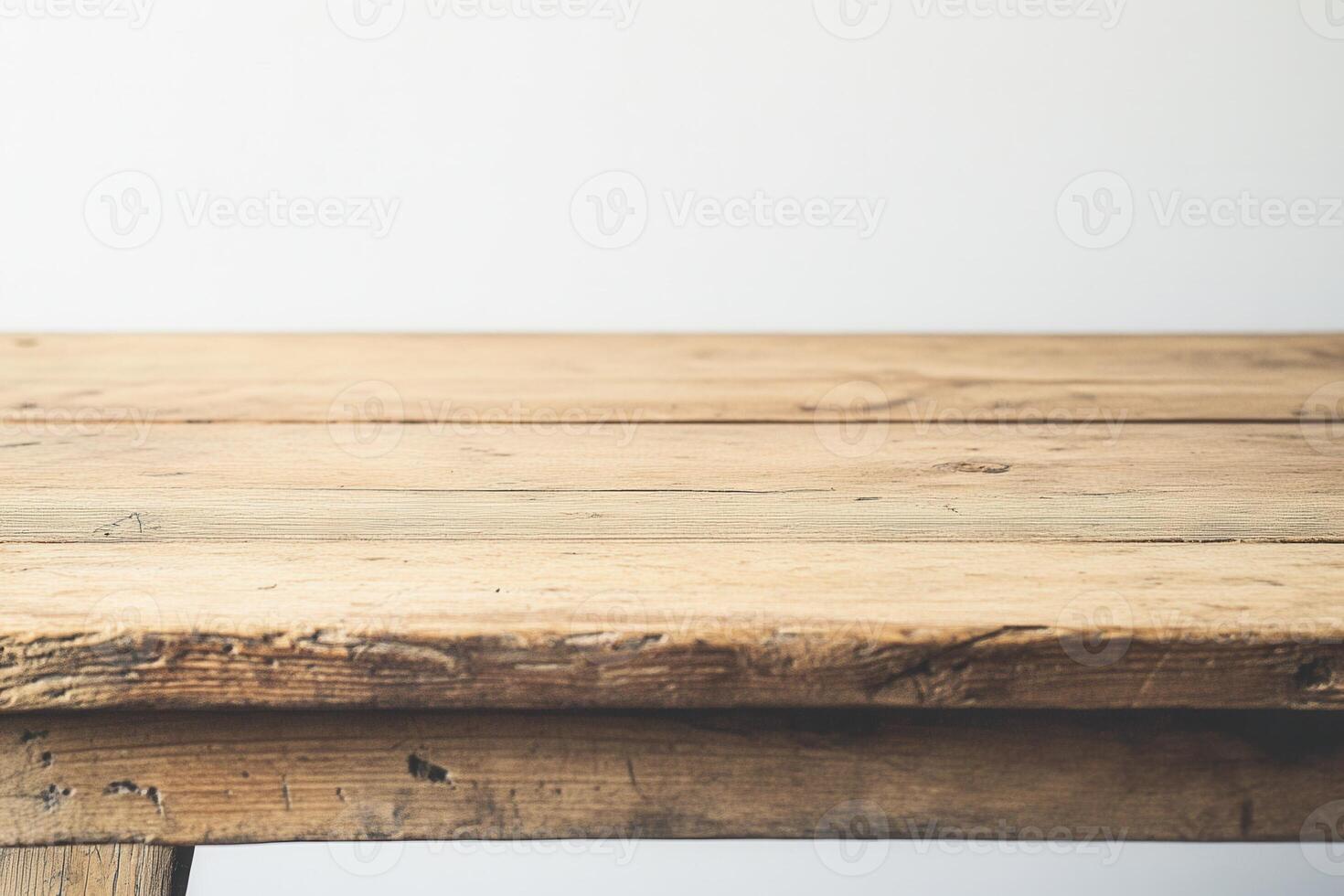 Wooden table surface with a rustic finish. photo