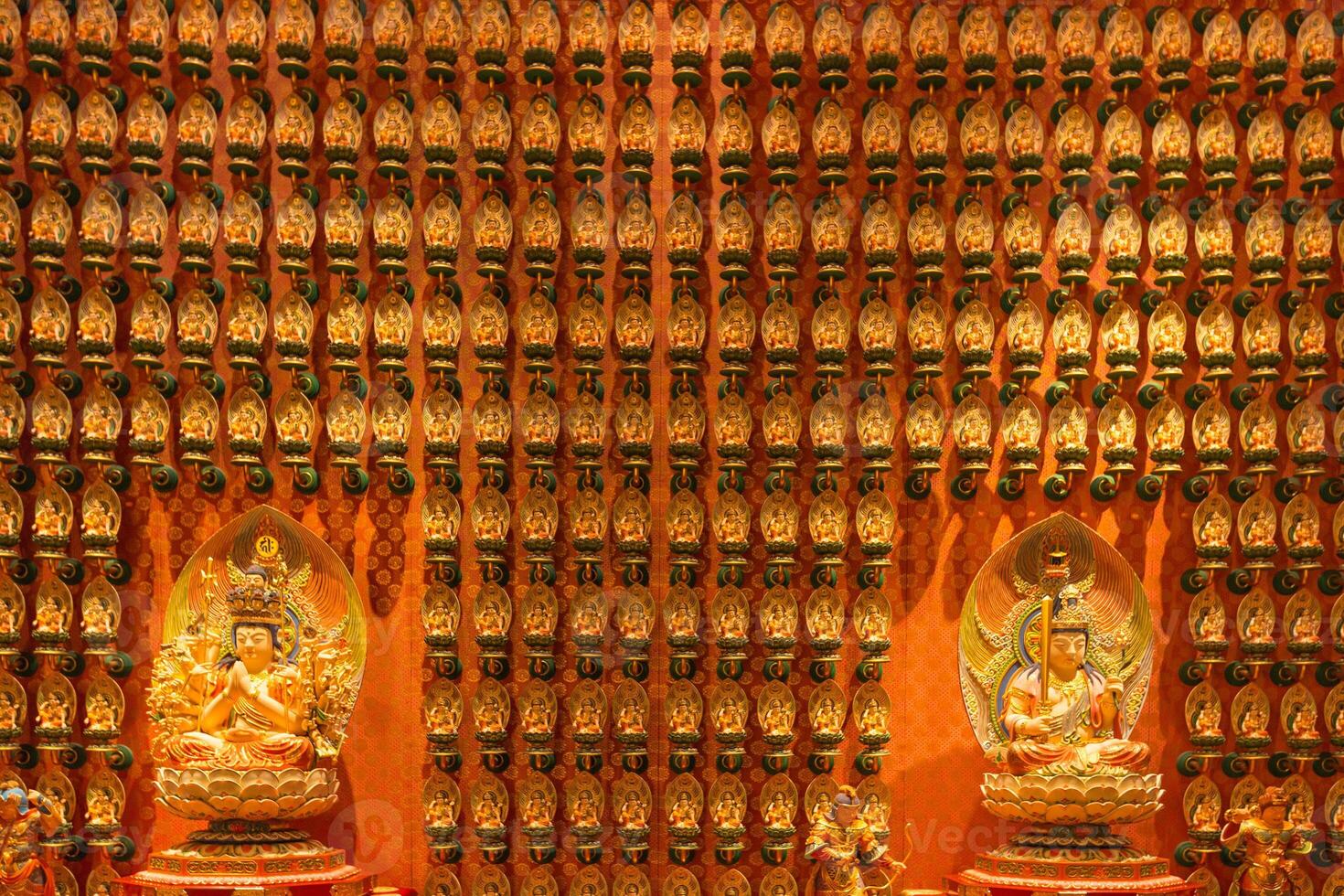 A room with many buddhas and other statues photo