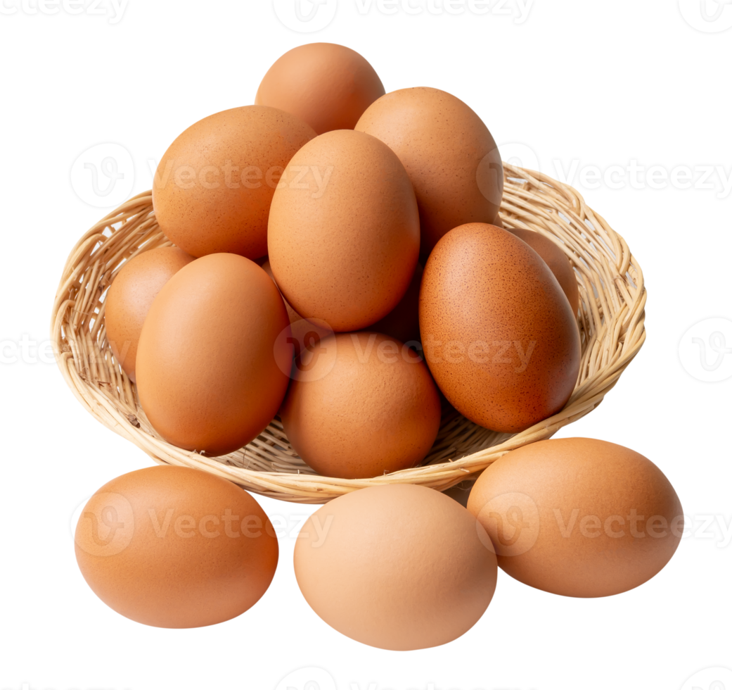 Top view of group of fresh brown chicken eggs in stack in wicker basket isolated with clipping path in file format png
