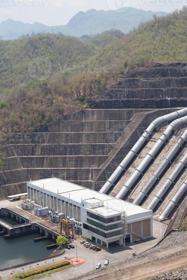 A large dam with a large water reservoir photo