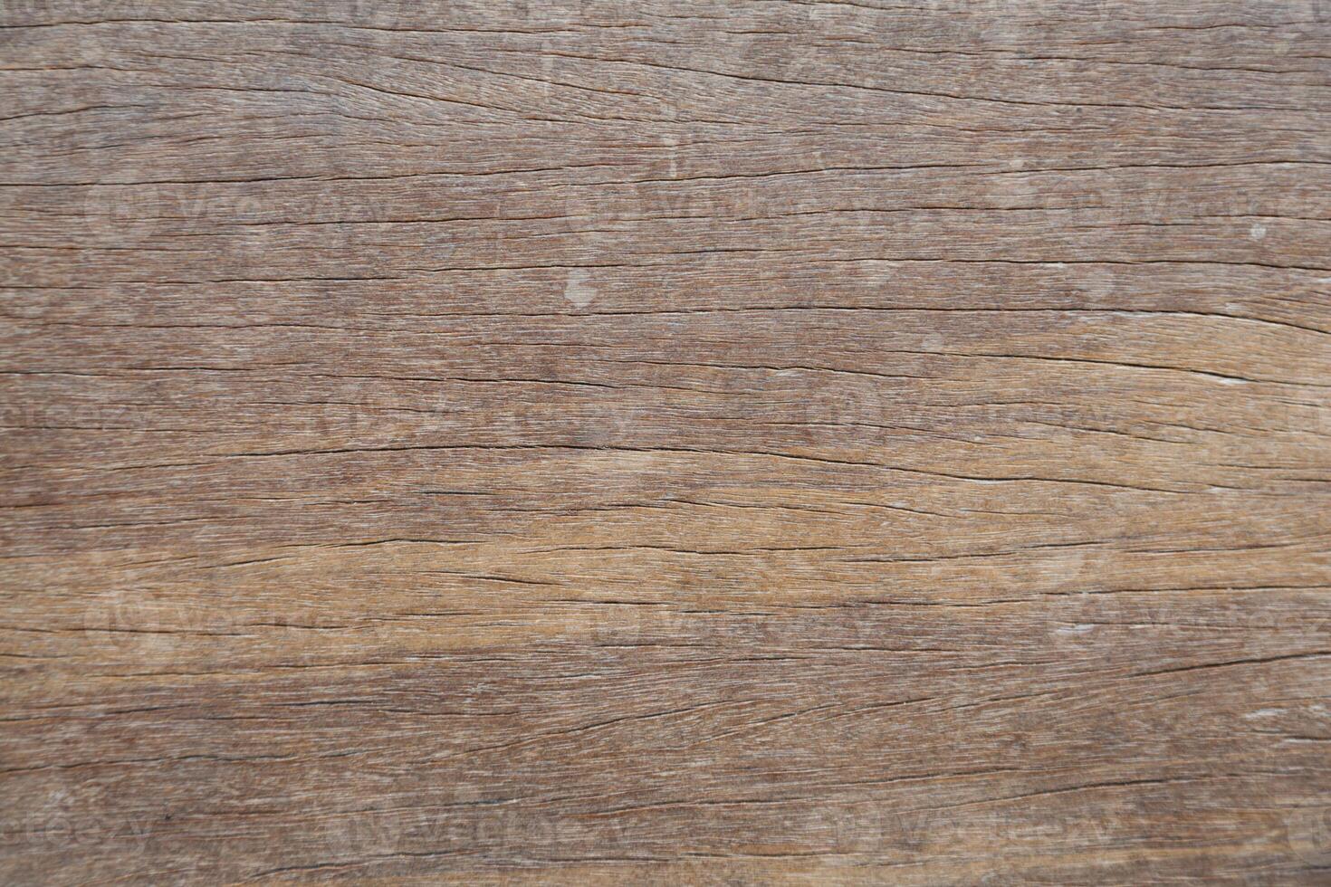 A close up of a wooden surface with some scratches photo