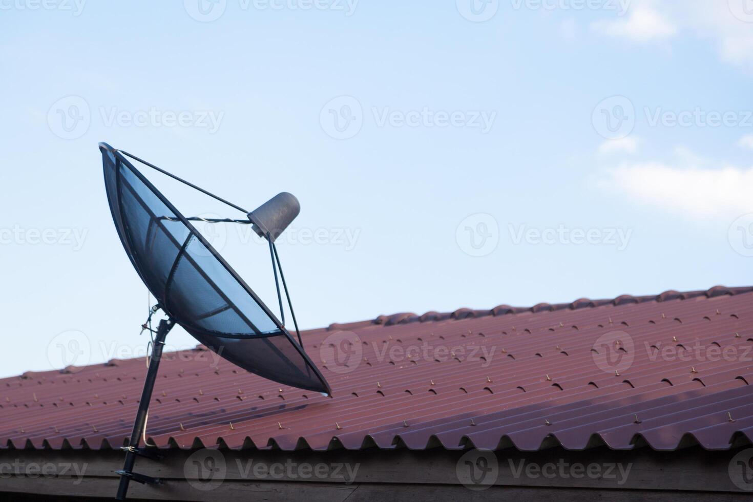 A satellite dish on a roof photo