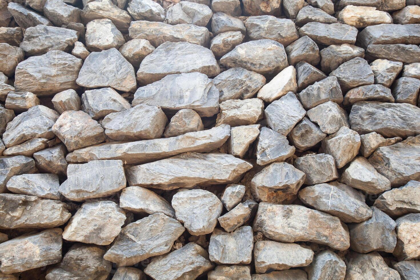 A pile of rocks that are stacked together photo