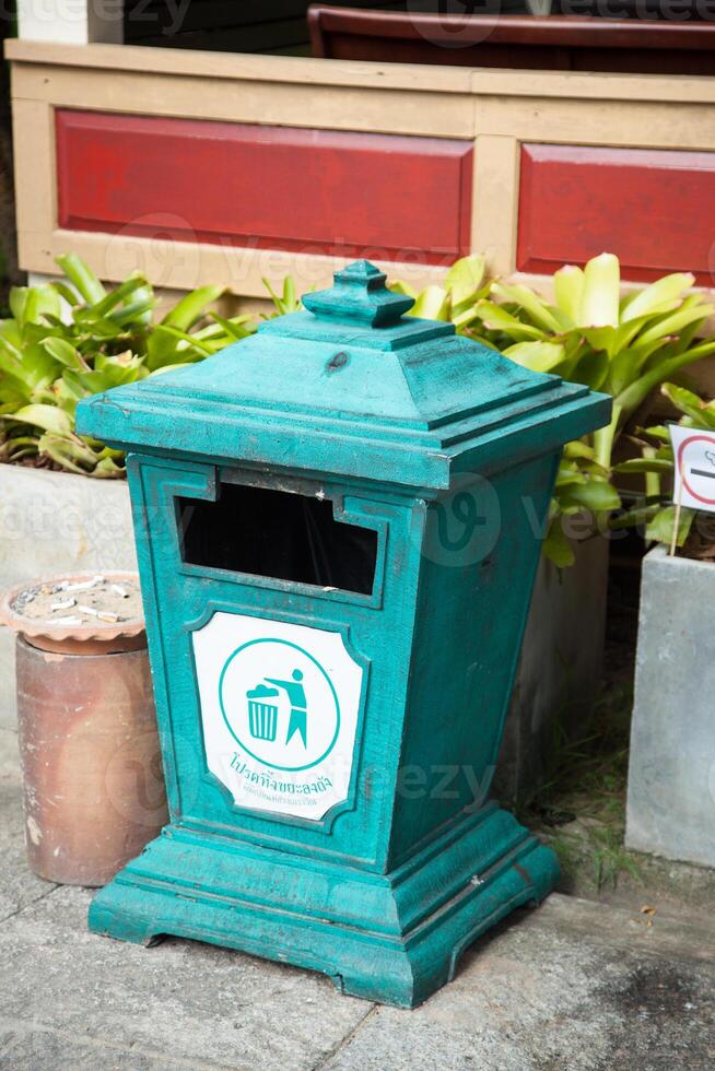 A green trash can photo