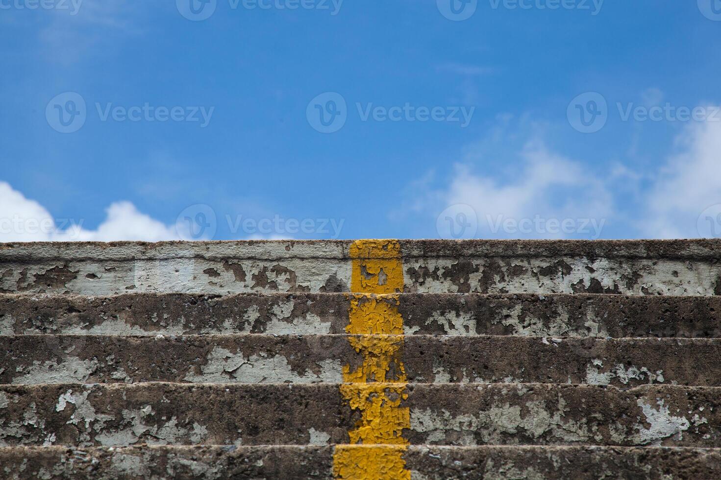 A yellow line on the side of a stairway photo
