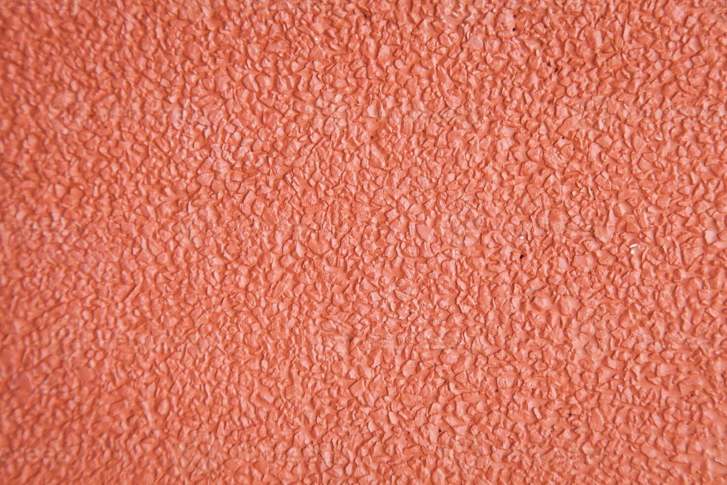 A close up of a red painted wall photo