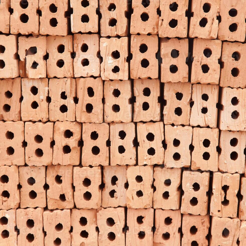 A pile of bricks with holes in them photo