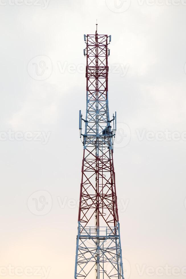 A tower with a red and white tower photo