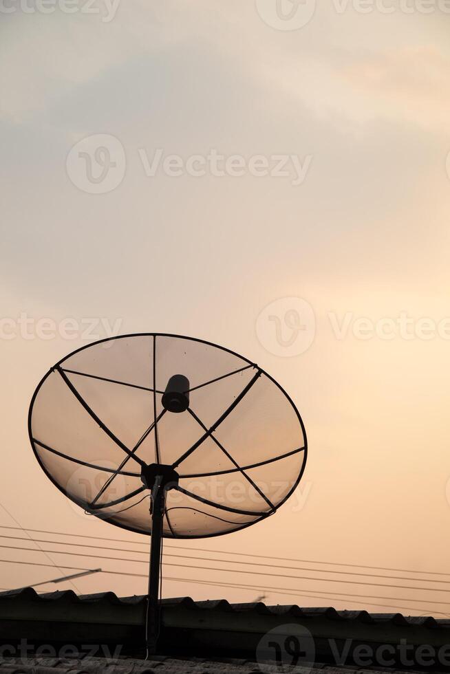 A satellite dish on a roof photo