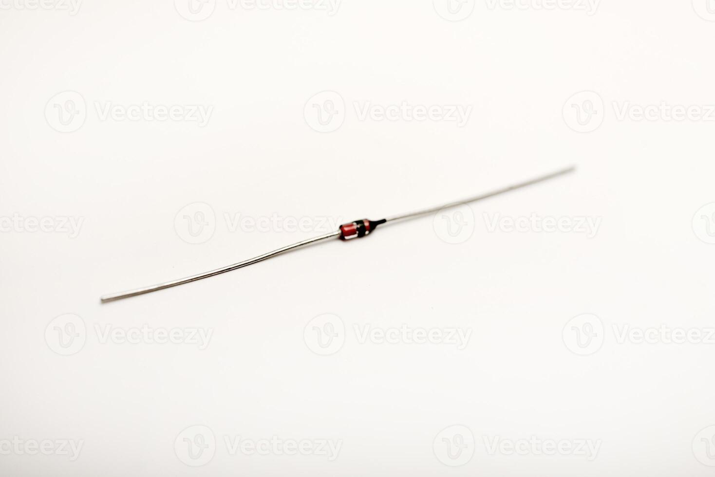 A radio element on a white background. A zener diode. photo