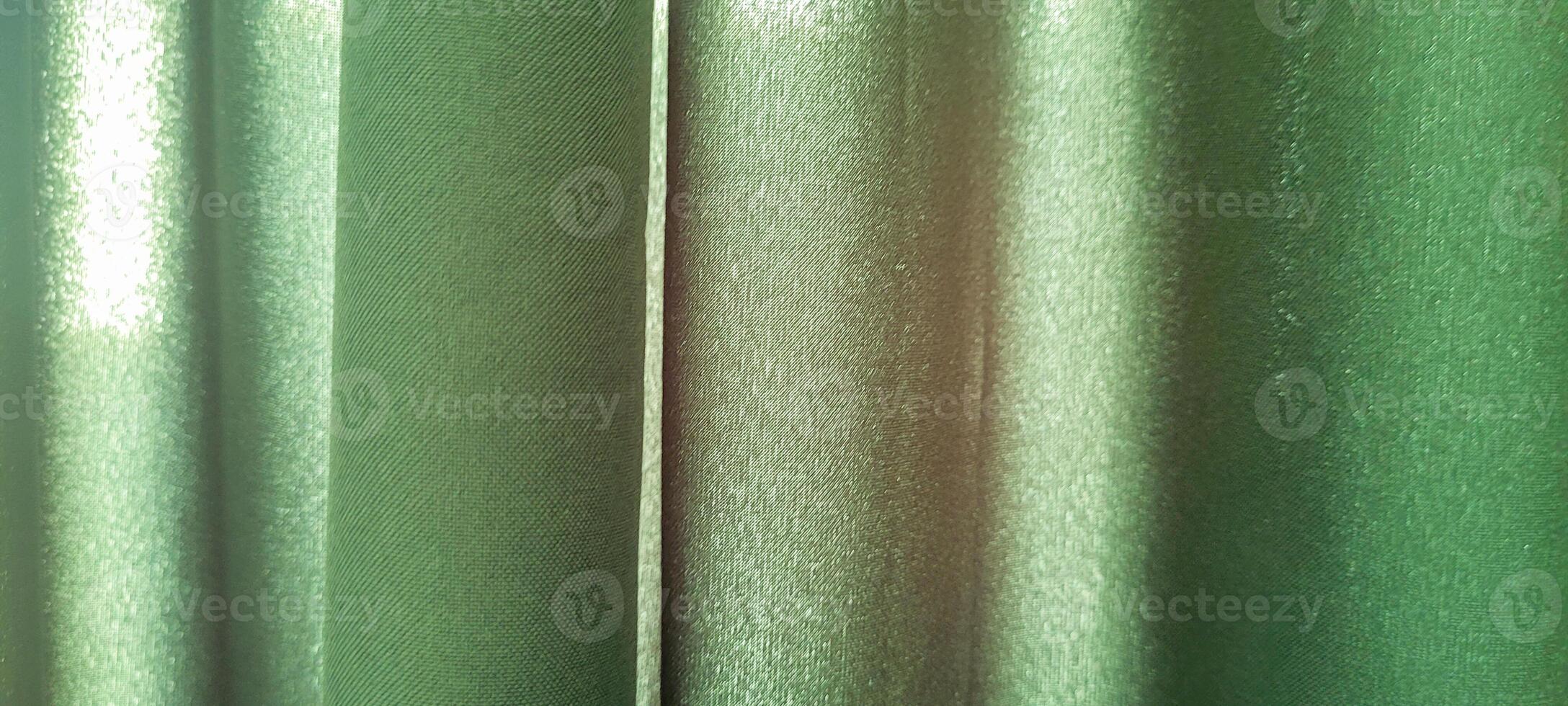 dark green curtain fabric on home wall photo