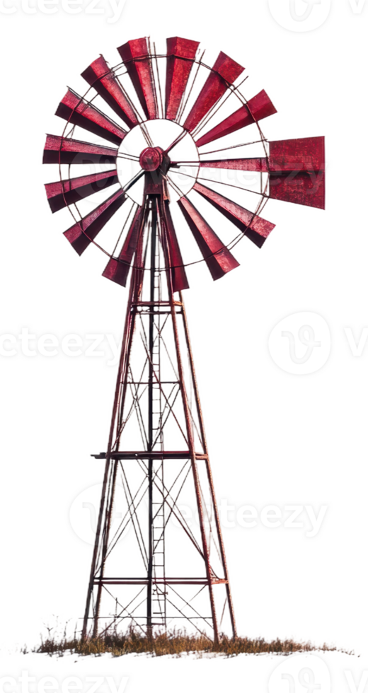A rusted windmill stands tall against a white background in a rural setting, cut out - stock . png