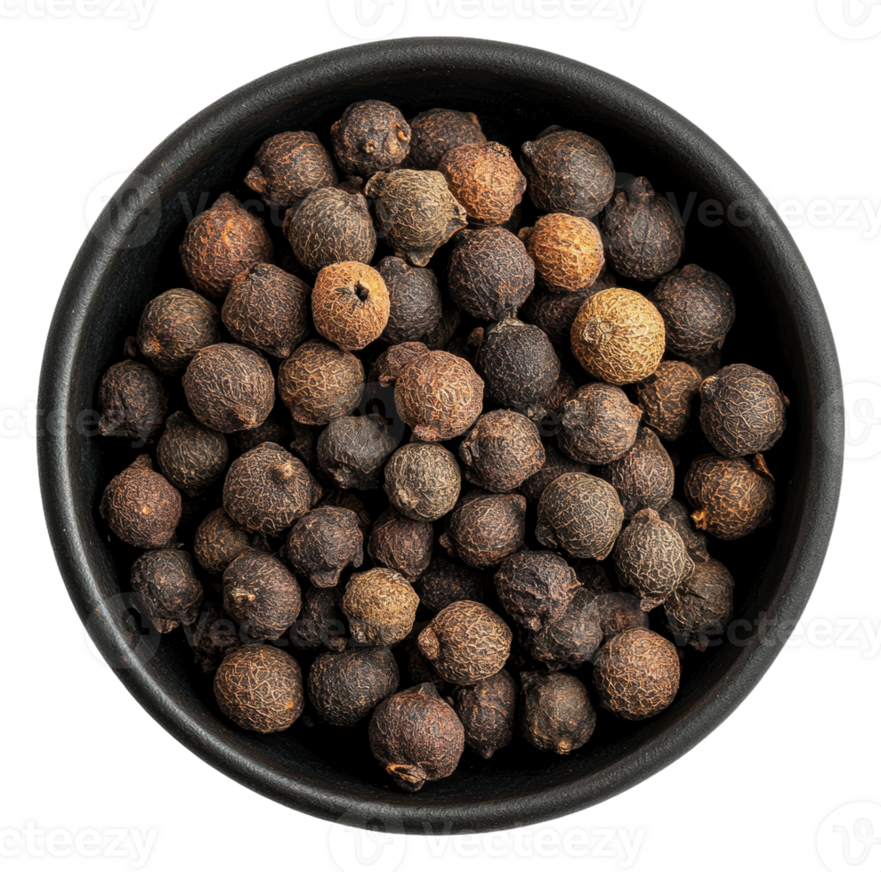 Variety of whole black pepper seeds in a bowl png