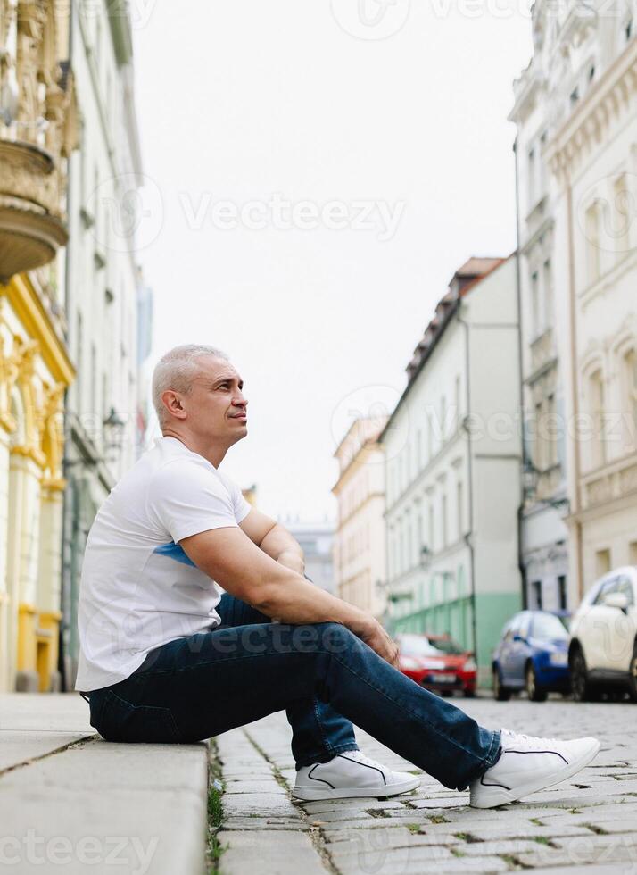 A man in a white shirt photo